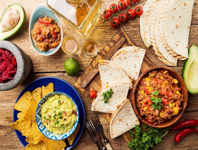 Various different plates of Mexican food
