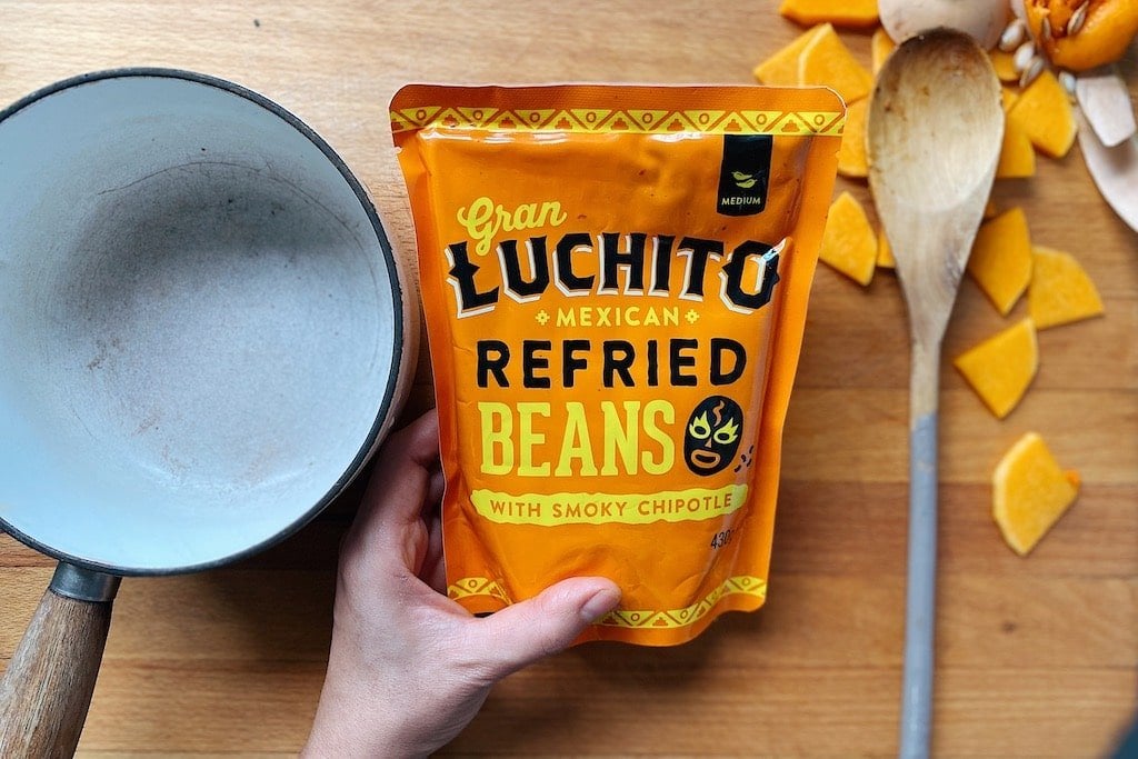 Vegan Nachos prep step heating refried beans
