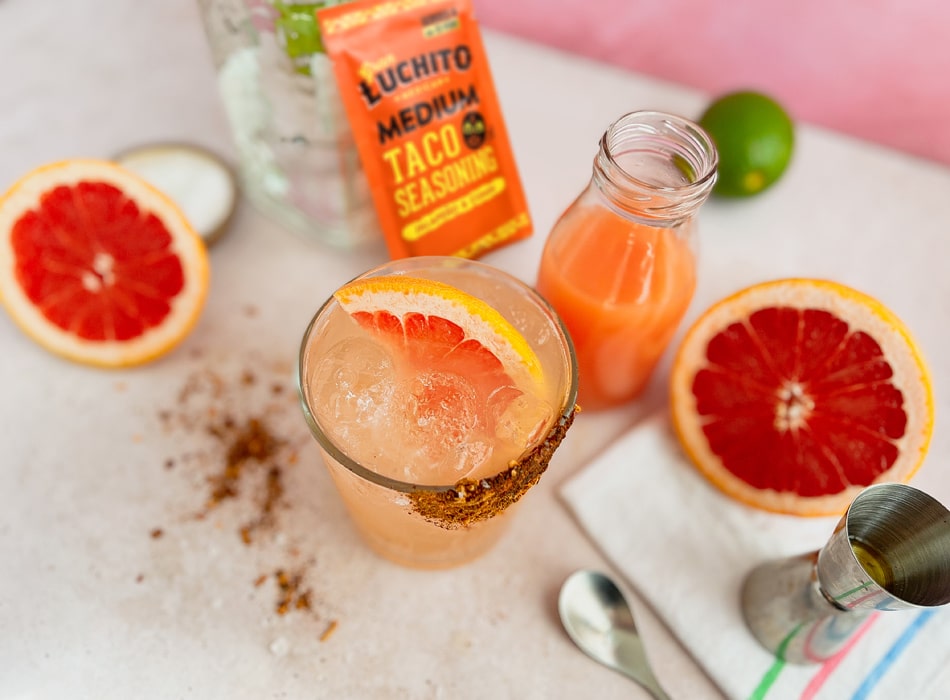 Paloma Cocktail with tequila grapefruit lime and a Medium Taco Seasoning Rim